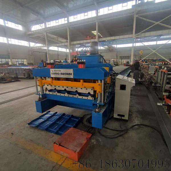 Pre-painted galvanized steel coil feeding into the Hebei Xinnuo Cuba 1000 machine.