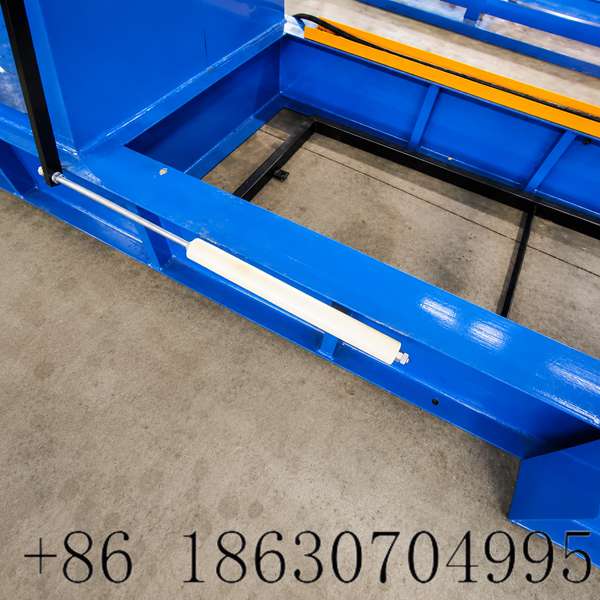 Material hold down device on hydraulic decoiler