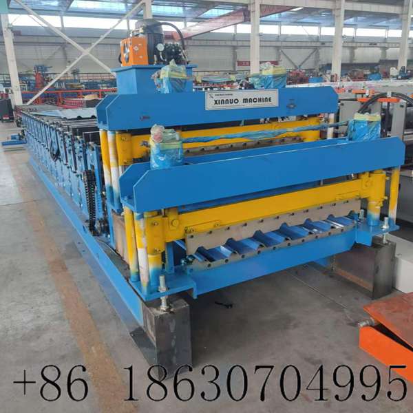 Side view of dual trapezoidal roof panel roll forming equipment
