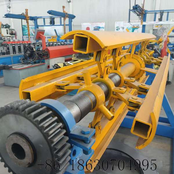 Steel coil mandrel core shaft with hardened surface and keyway slot connecting to the main drive gear for transmitting motor torque during controlled unwinding