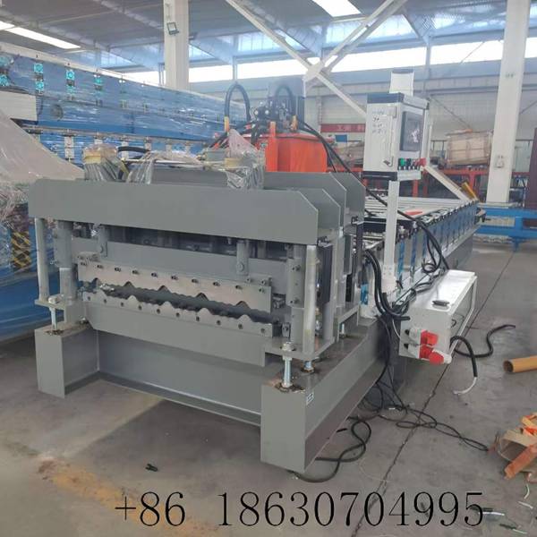 Machine cutting direction front view displaying the hydraulic step-stamping station and finished 748mm glazed tile profile output