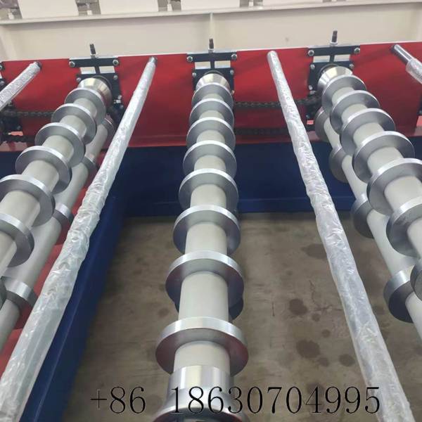 Close-up of GCr15 precision rollers with hard chrome plating and mirror-polished surface on the 1020 IBR roof sheeting machine, treated for moisture and rust resistance