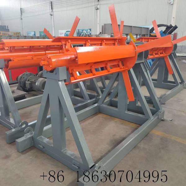 Manual steel coil decoiler machine for metal roofing line showing full mechanical assembly with 5-ton capacity and structural steel base