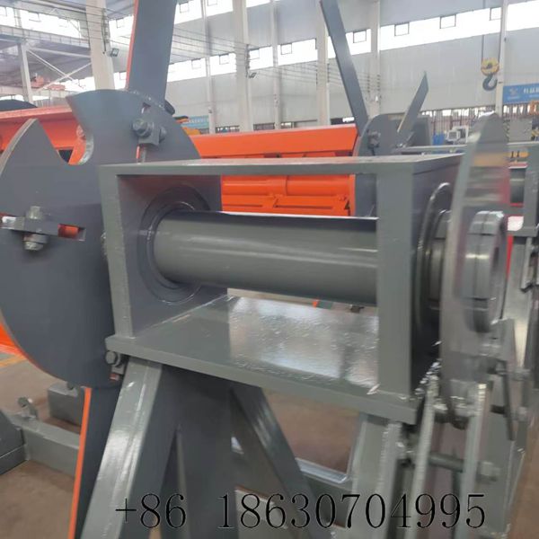 Expandable mandrel core with four adjustable support arms to secure steel coils with inner diameters ranging from 460 to 520 millimeters