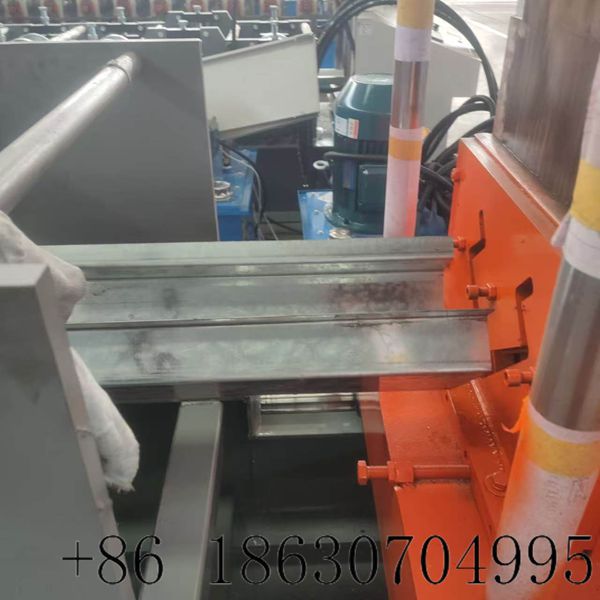 Discharge end producing finished corner post profiles for container houses