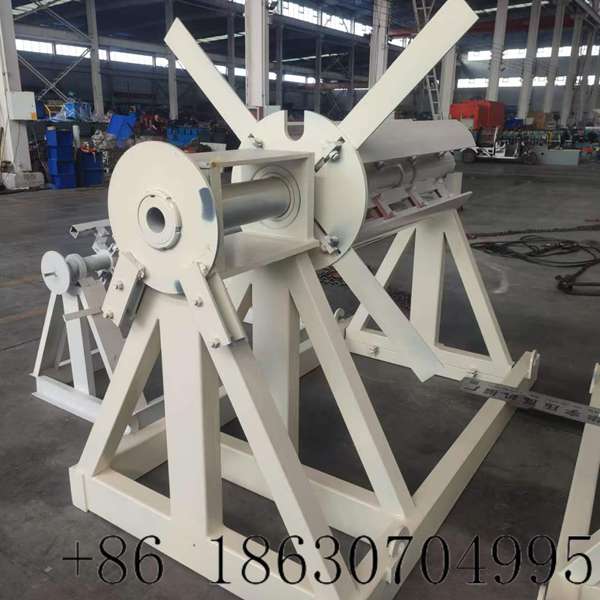 7 ton manual decoiler overall view feeding steel strip to the forming line
