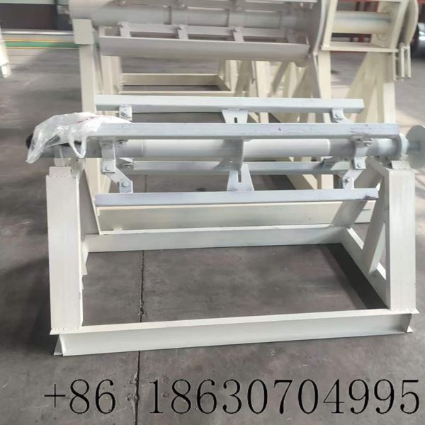 Manual steel coil decoiler in the factory workshop