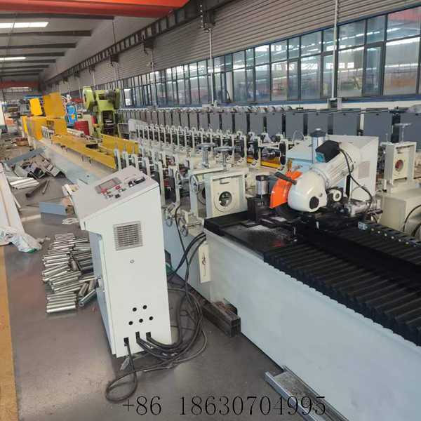 Front view of the PU roller shutter door forming machine with precision rollers and cutting unit