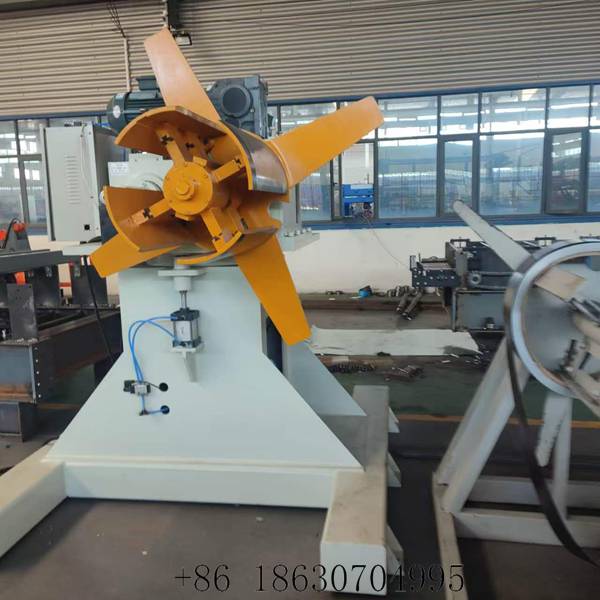 5 ton hydraulic uncoiler feeding steel coil into the PU roller shutter door line