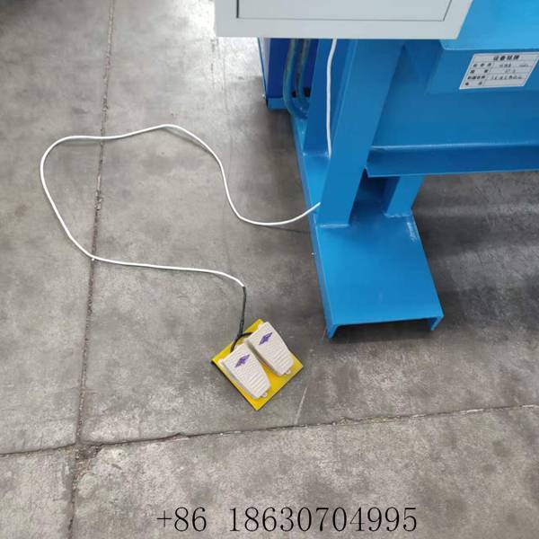 Foot switch on the floor beside the hydraulic sheet shearing machine for hands-free cutting strokes