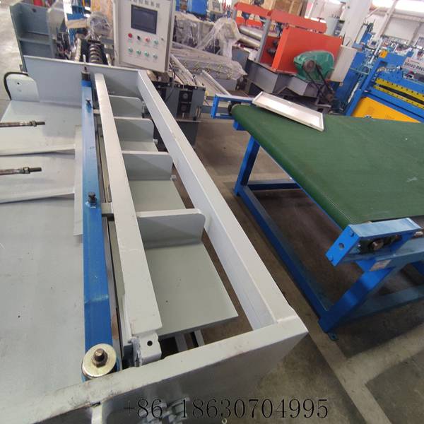 Top view of the electric sheet metal shearing machine showing the upper roller assembly and hold-down beam