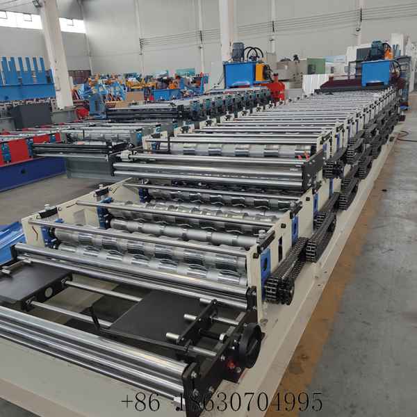 View along the feed platform of the double layer roof panel roll former, showing the infeed side and forming rollers