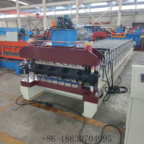 Front view of the 1000+1000 double layer metal roof panel forming machine showing the lower roller station and shear end