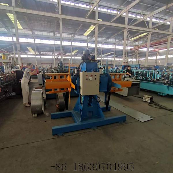 Side view of heavy duty double head hydraulic uncoiler machine